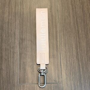 lululemon pale pink wrist strap key fob with silver hardware